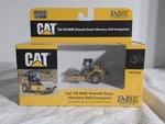 Norscot Cat CS-563E Smooth Drum Vibratory Soil Compactor 1:87 Diecast Metal. Fixed Price $39.98.