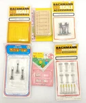 6 Ho Scale Accessory Packs New Lights, Fence, Lumber, Signs, Tomb Stones. Fixed Price $19.99.