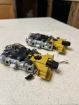 2 Lionel 4 Wheel Silver Diesel Freight Trucks With Pick / Coupler Yellow Step. Fixed Price $24.00.