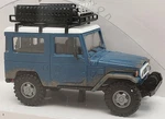 Busch New Ho 1/87 Scale Toyota Land Cruiser Weathered Blue Finish With White Top. Fixed Price $39.99.