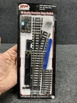 Atlas #851 Right Remote "snap" Switch, 18" Radius Turnout Code 100 (AT050126-02). Fixed Price $22.95.