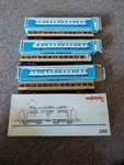 Marklin Ho Scale Electric Locomotive And Matching Passenger Cars #3355. Fixed Price $270.00.